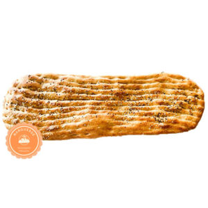 Close-up of Barbari bread with a golden brown crust and soft, fluffy interior